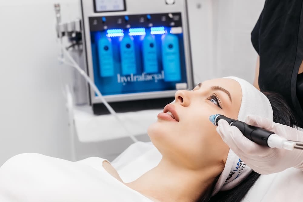 Patient receiving a HydraFacial in West Palm Beach at Body+Beauty Lab, where advanced treatments cleanse, exfoliate, and hydrate the skin.