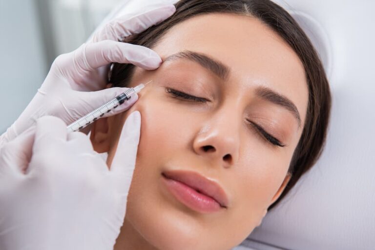 Close-up of a woman receiving a BOTOX® injection near the outer corner of her eye to smooth crow’s feet and achieve a youthful, refreshed look