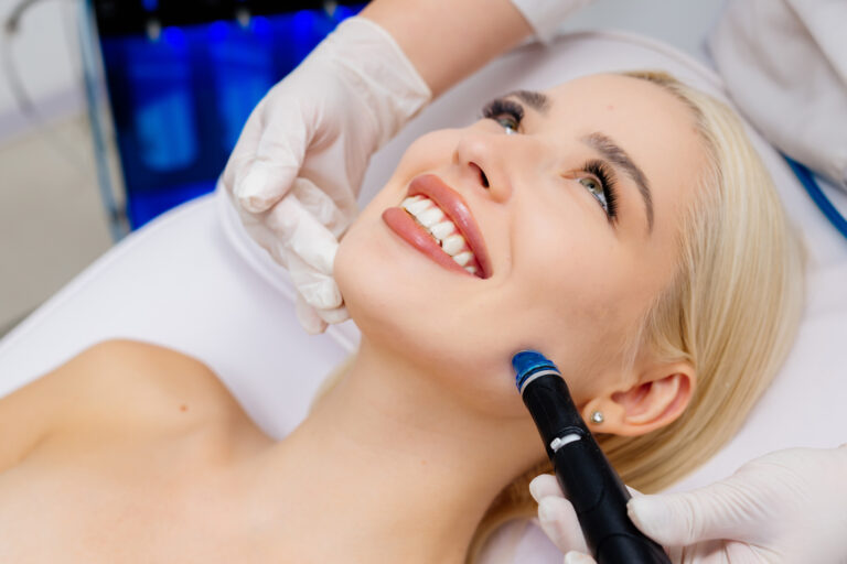 Woman relaxing during HydraFacial® treatment highlighting deep cleansing and hydration benefits.