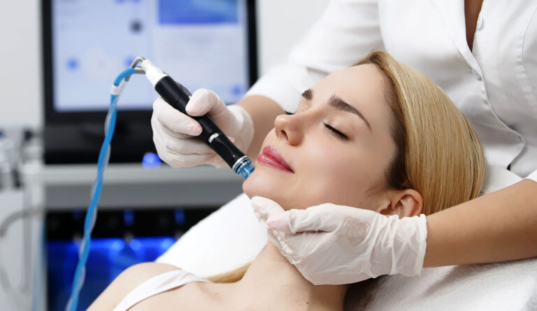 Professional hydrafacial session using serum infusion wand highlighting factors behind hydrafacial cost.