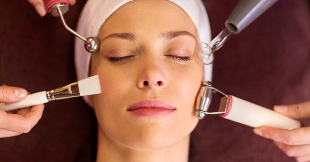 Aesthetician administering a facial injection or skin treatment to a female client at a med spa