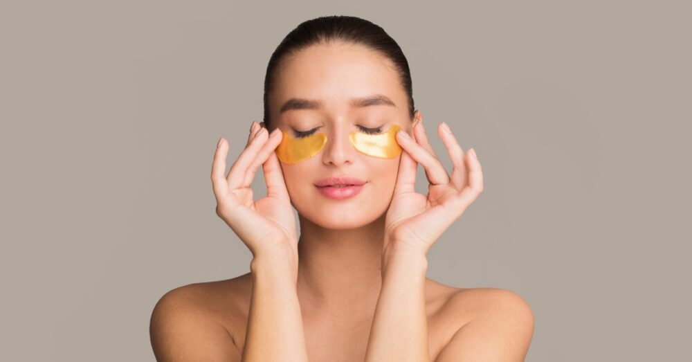 Woman wearing gold under eye patches